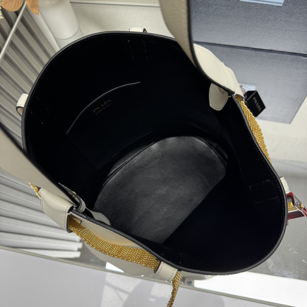 Pra*a buckle leather bucket bag with jeweled belt